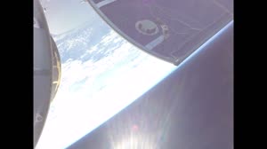 Orion Solar Array Wing #2 View of Spacecraft Adapter Jettison Fairing Panels Separating